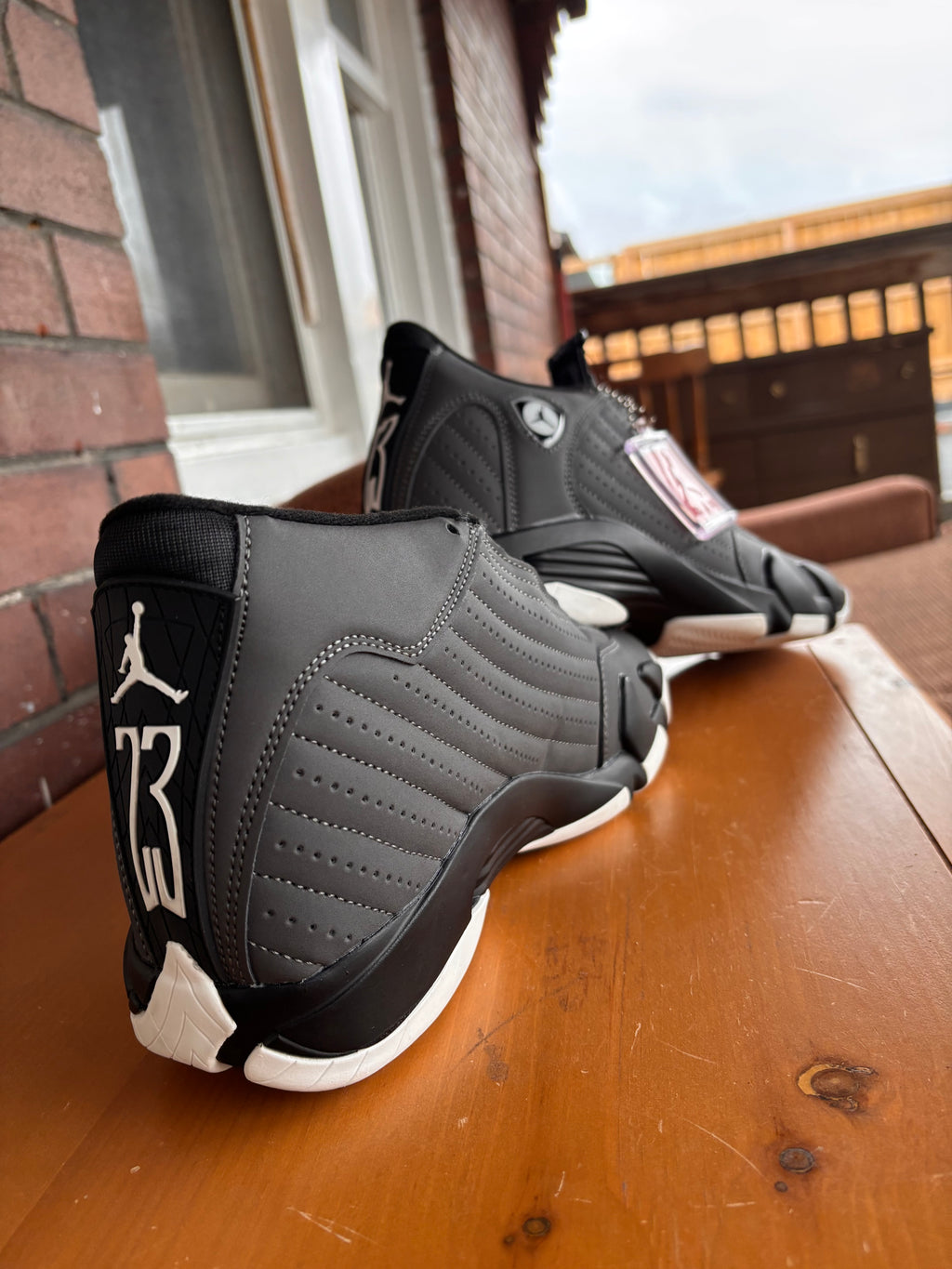 Air Jordan 14 Retro sneakers in a black and white colorway