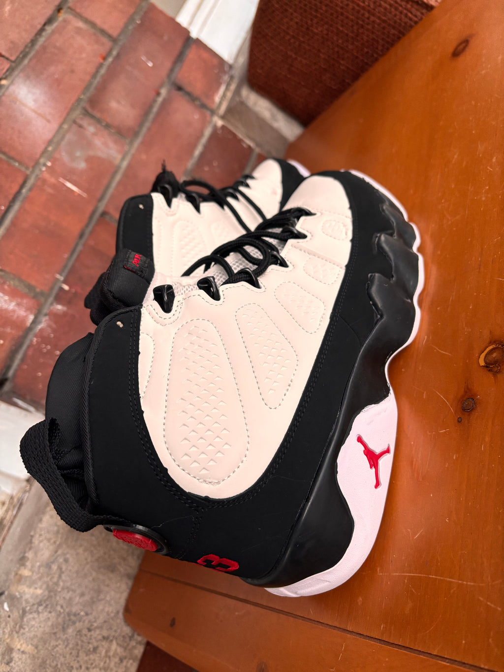 Air Jordan 9 Retro in the white, black, and true red colorway