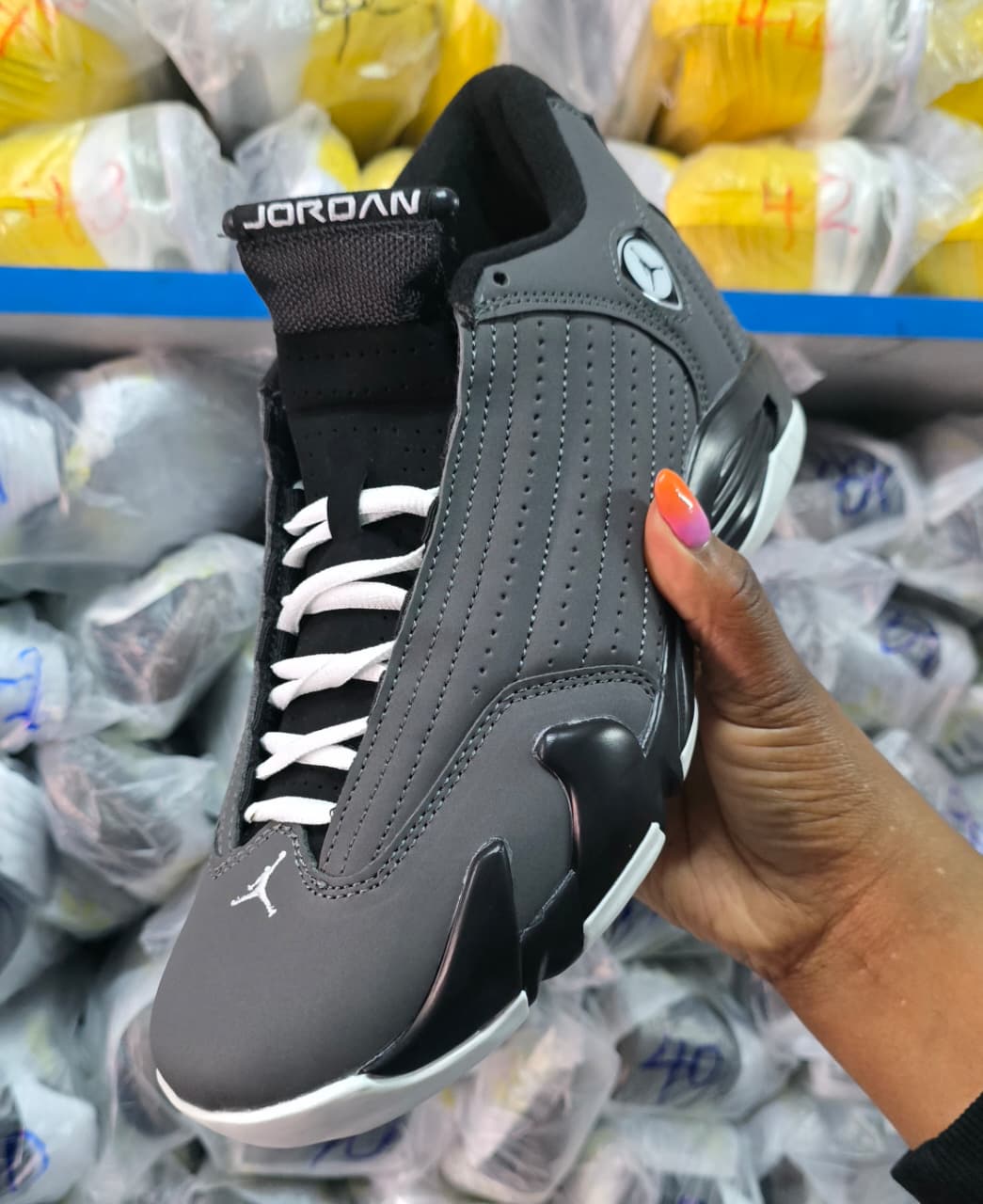 Air Jordan 14 Retro sneakers in a black and white colorway