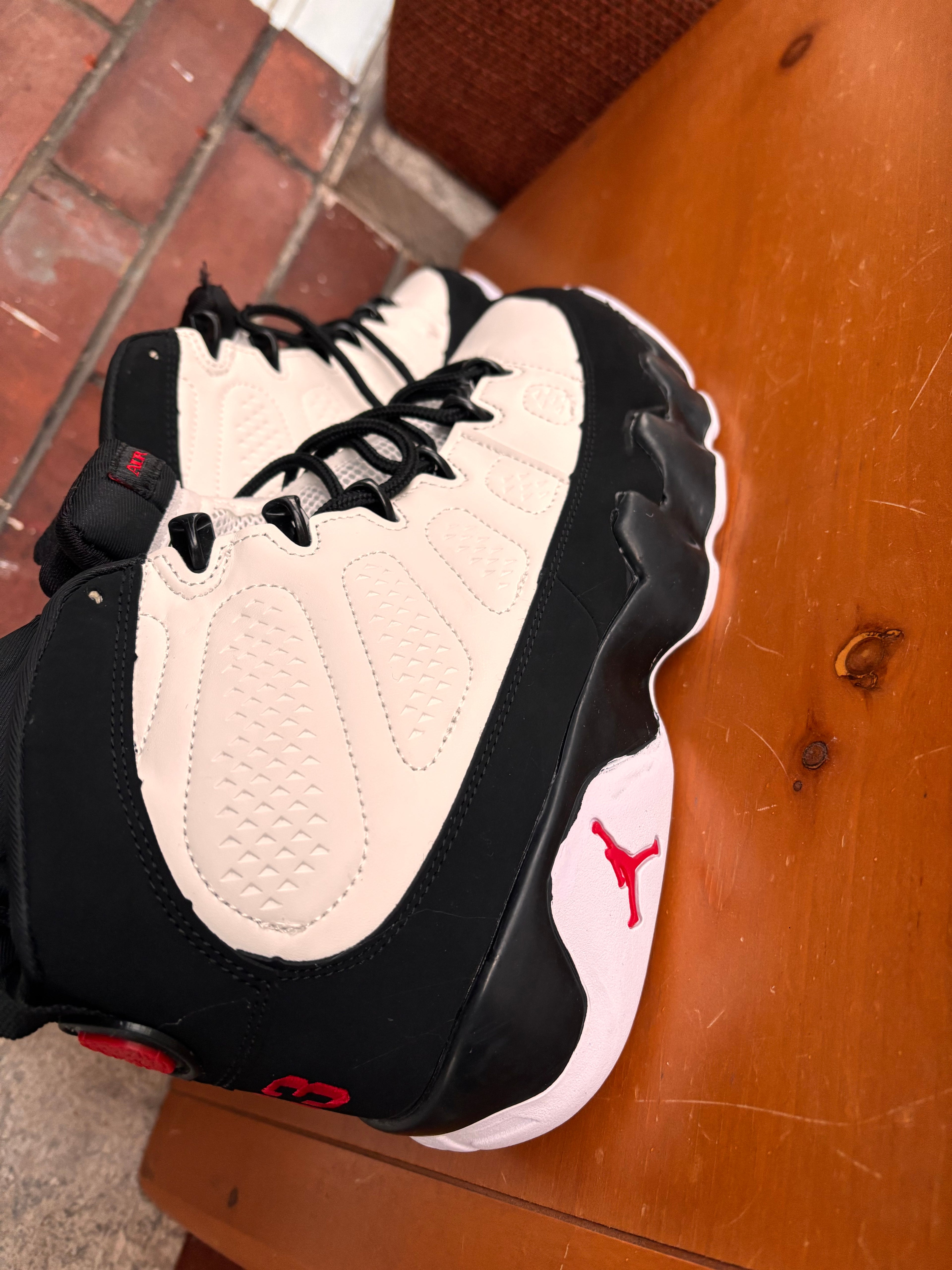 Air Jordan 9 Retro in the white, black, and true red colorway