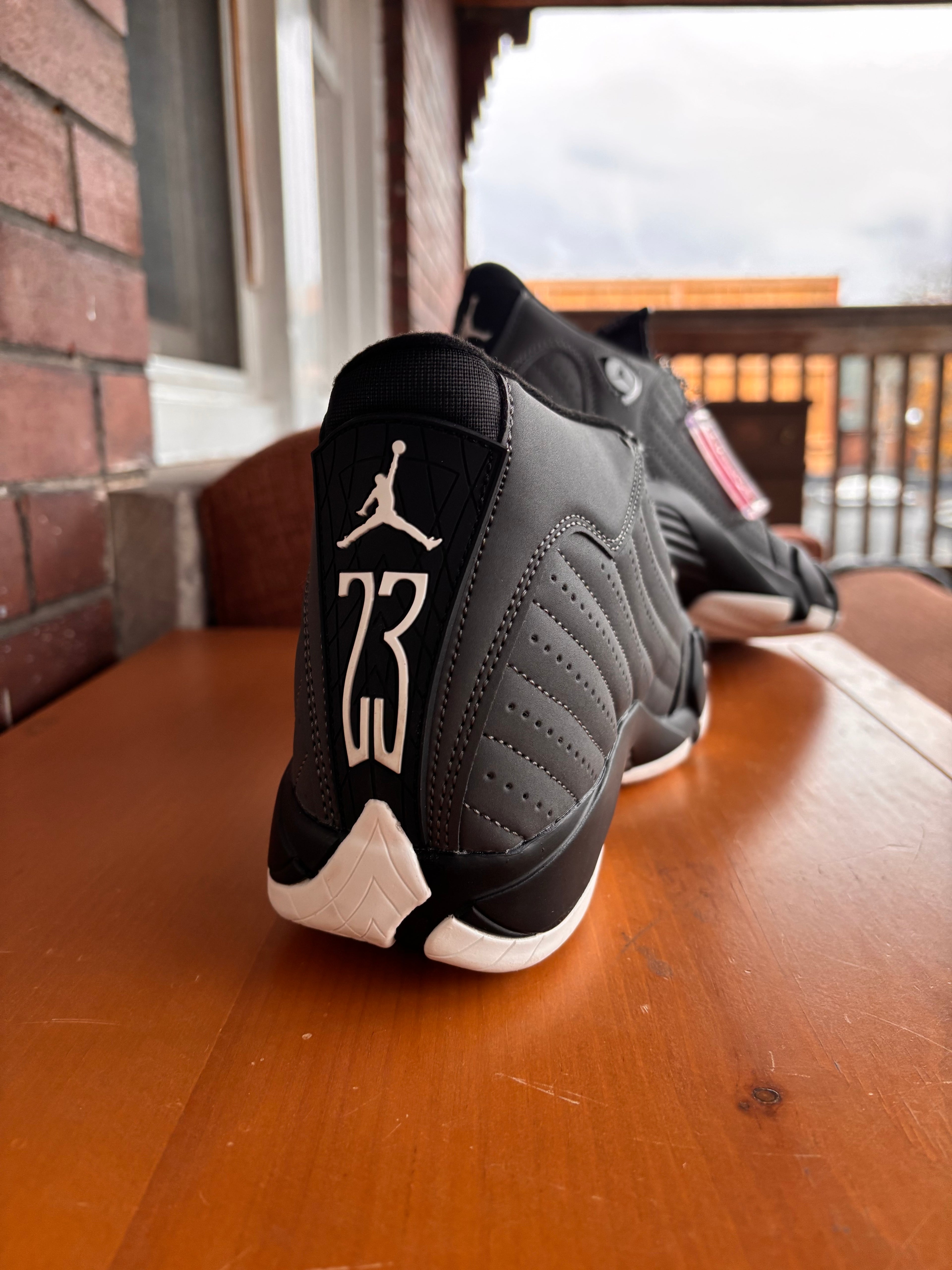 Air Jordan 14 Retro sneakers in a black and white colorway