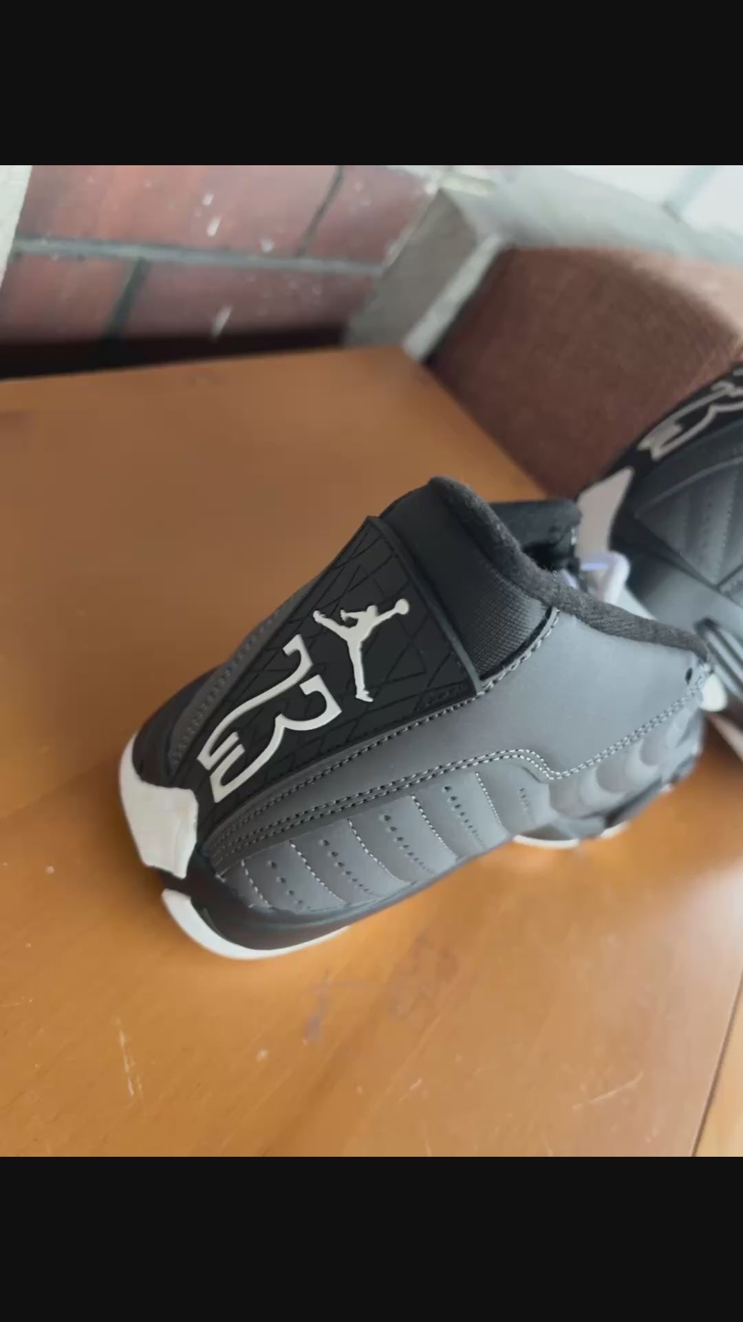 Air Jordan 14 Retro sneakers in a black and white colorway