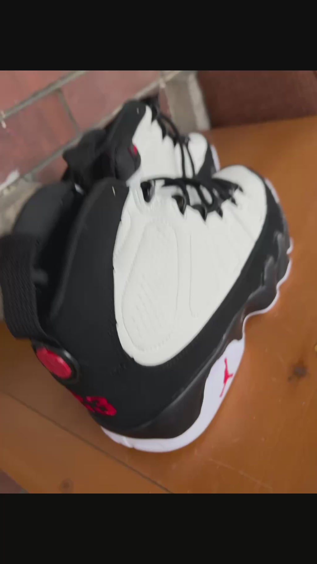 Air Jordan 9 Retro in the white, black, and true red colorway