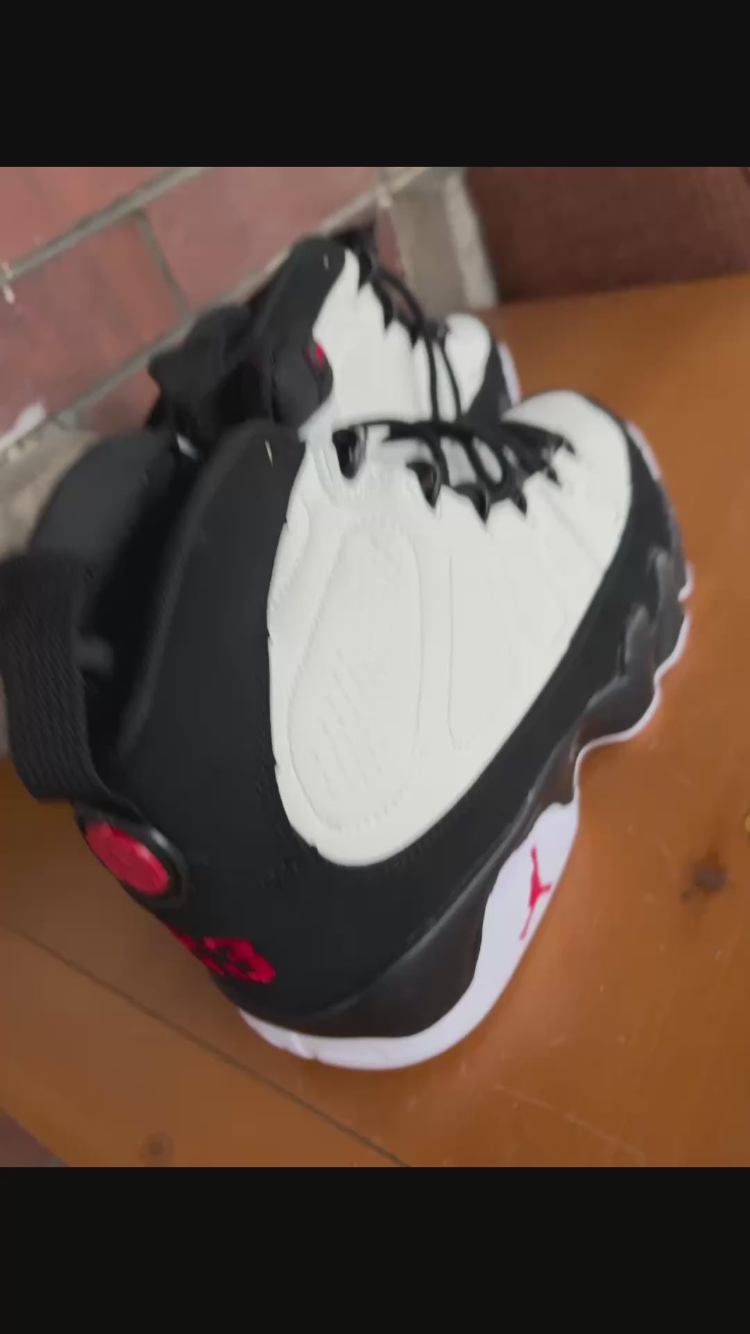 Air Jordan 9 Retro in the white, black, and true red colorway